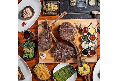 Steak board, sauces, and vegetables